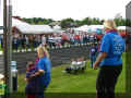 Mama Loni helping Codi down the hill from the stage.