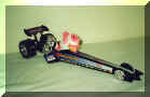 Pinky the fish, in a toy dragster the racers had dropped off. Pinky kept me company during my hospitalization and had a number medical procedures done on him - if u only knew...