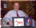 Oregon Governor Ted Kulongoski holding the picture I made for him.