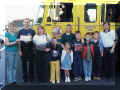 Presenting the check to my family and friends.